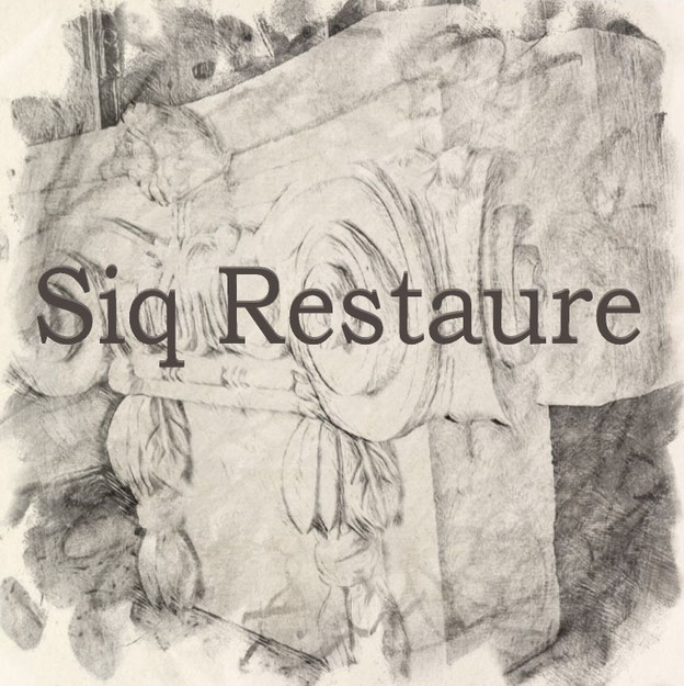 Artisan SIQ Restaure au travail sur une façade en pierre de taille